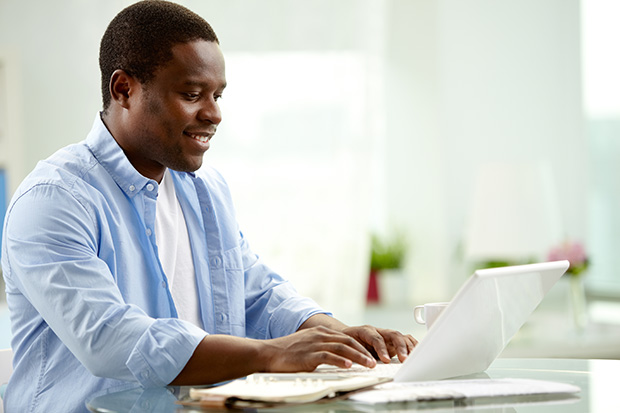 student using a laptop at home