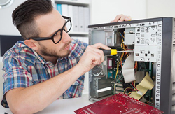 Technician inspecting a PC